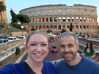 My wife and I in front of the Colosseum in Rome